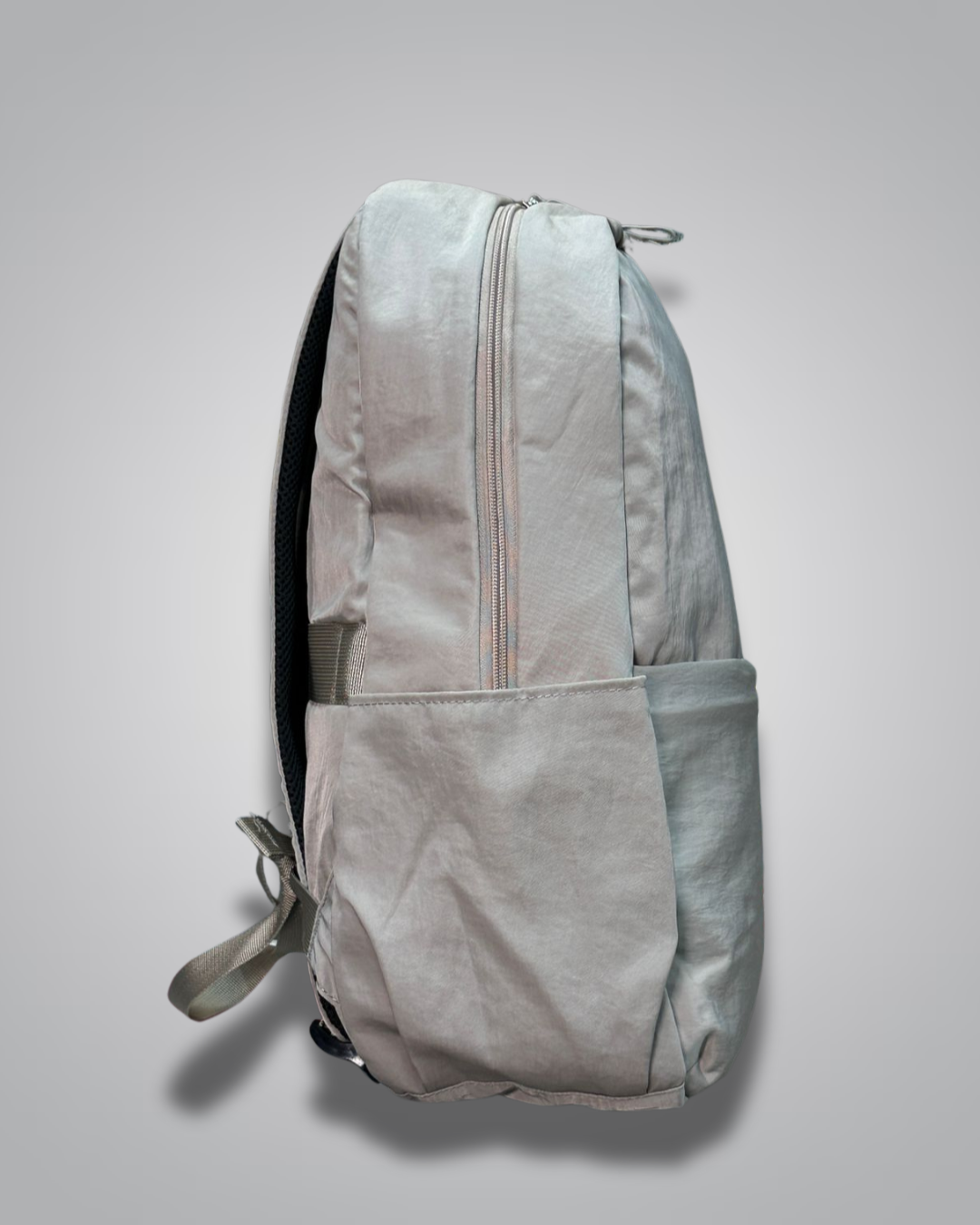 Light gray backpack on a light gray background- valentini impex