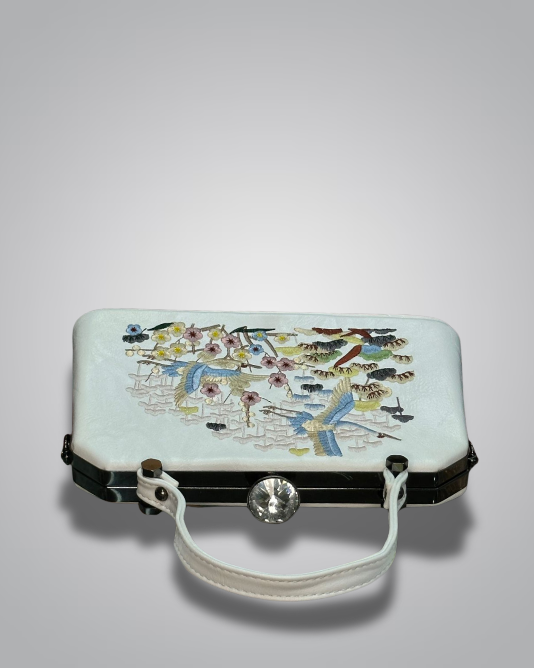 Embroidered handbag with floral and bird design on a light gray background- Valentino Impex