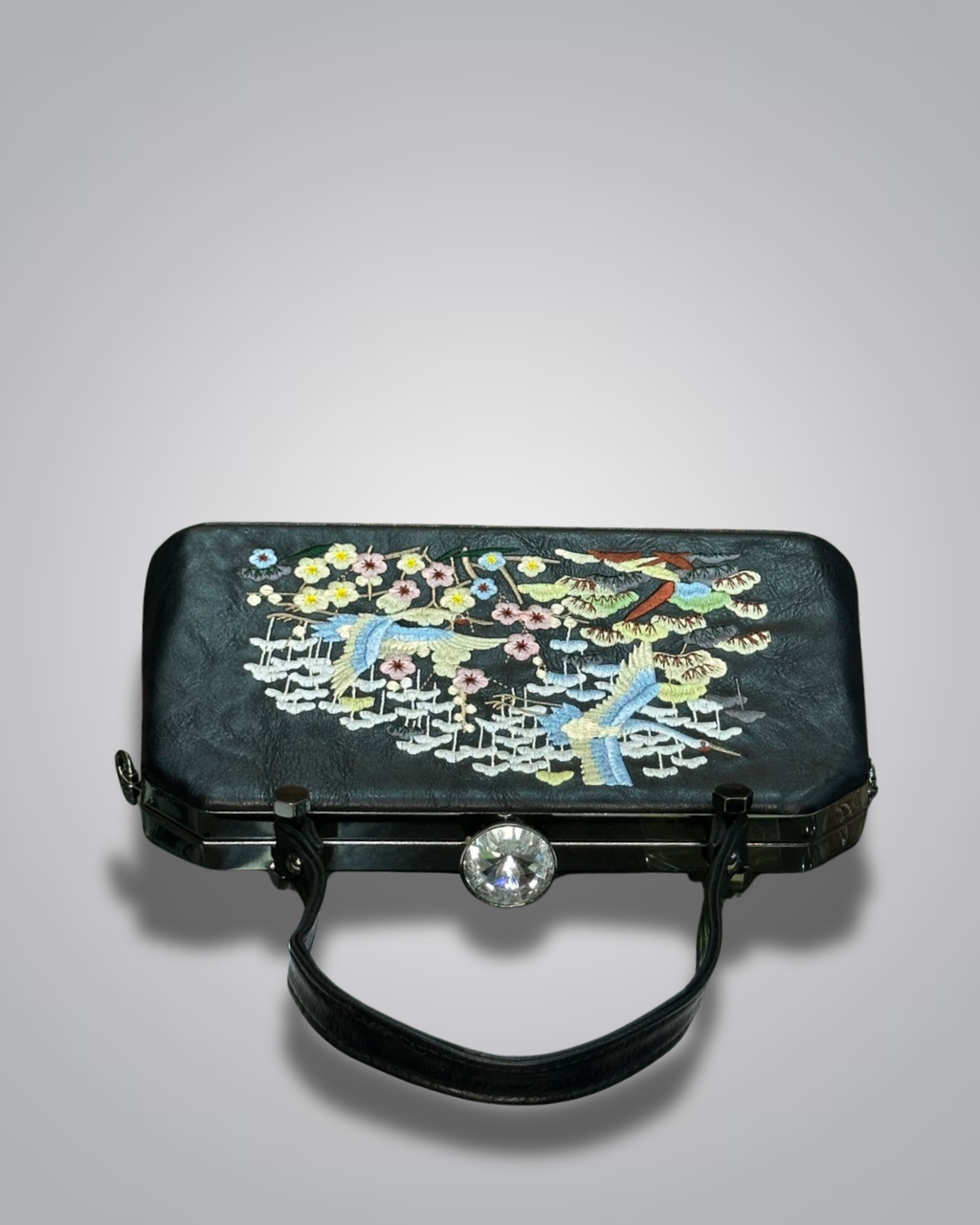 Black handbag with floral embroidery on a gray background-Valentino Impex