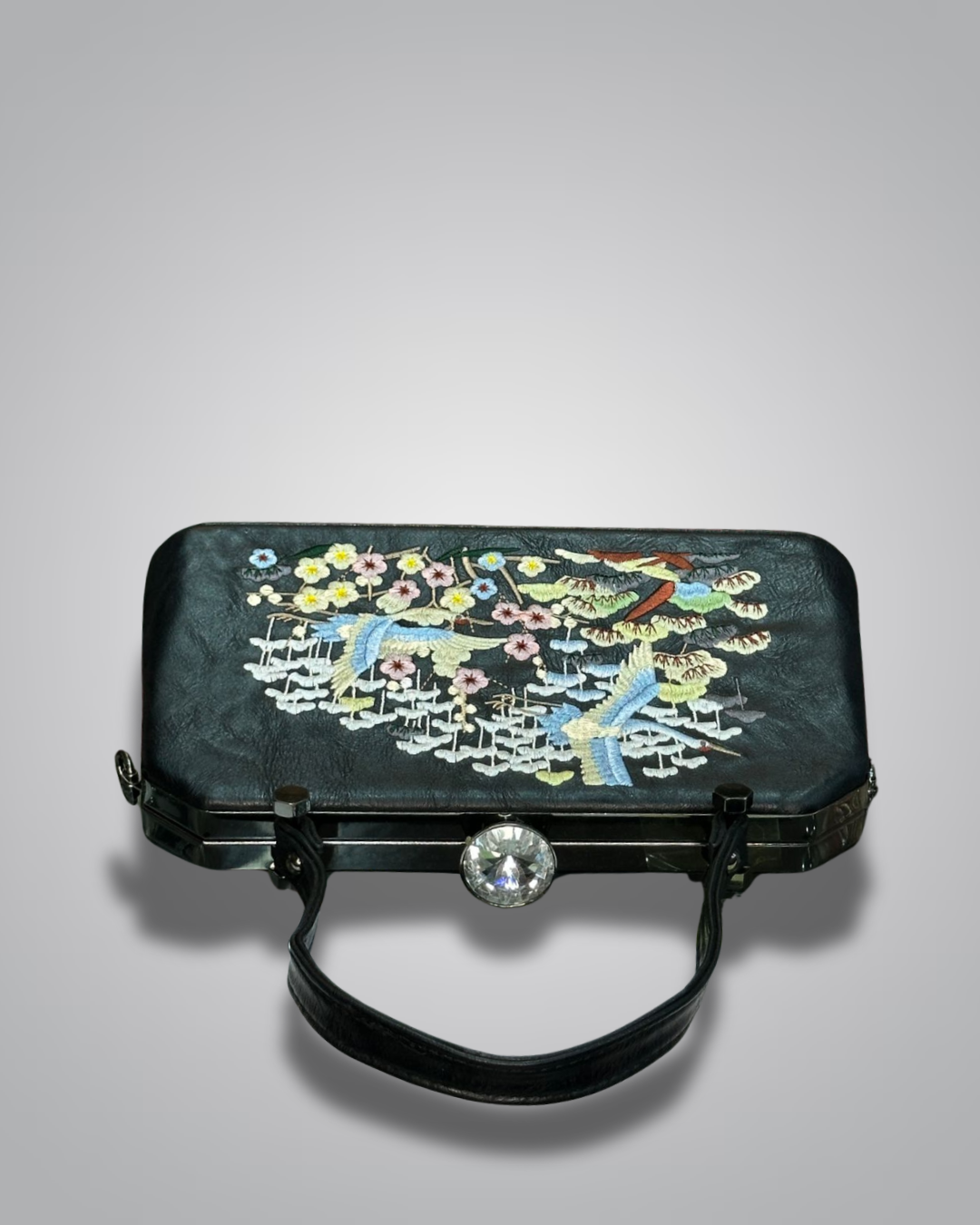 Black handbag with floral embroidery on a gray background-Valentino Impex