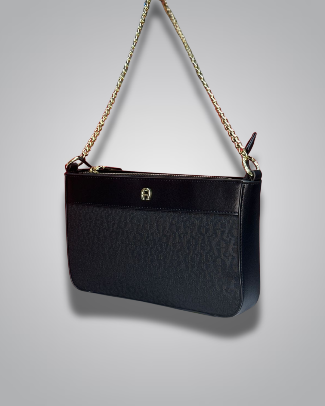 Black handbag with gold chain strap on a gray background- Valentino Impex