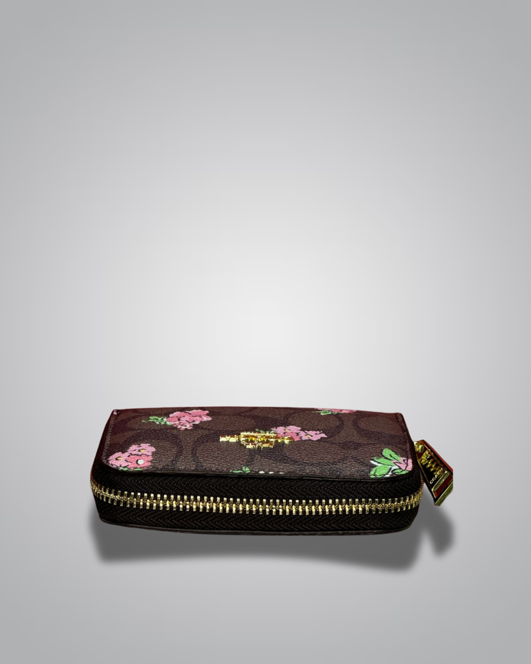 Coach wallet with floral design on a gray background- Valentino Impex