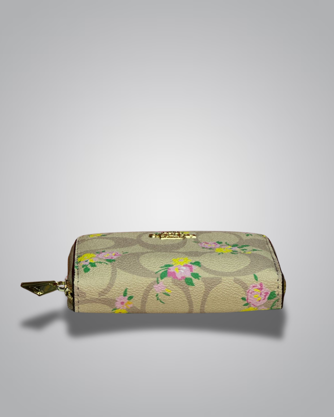 view of Coach Signature Floral Zip Wallet in beige with yellow and pink flower accents- Valentino Impex
