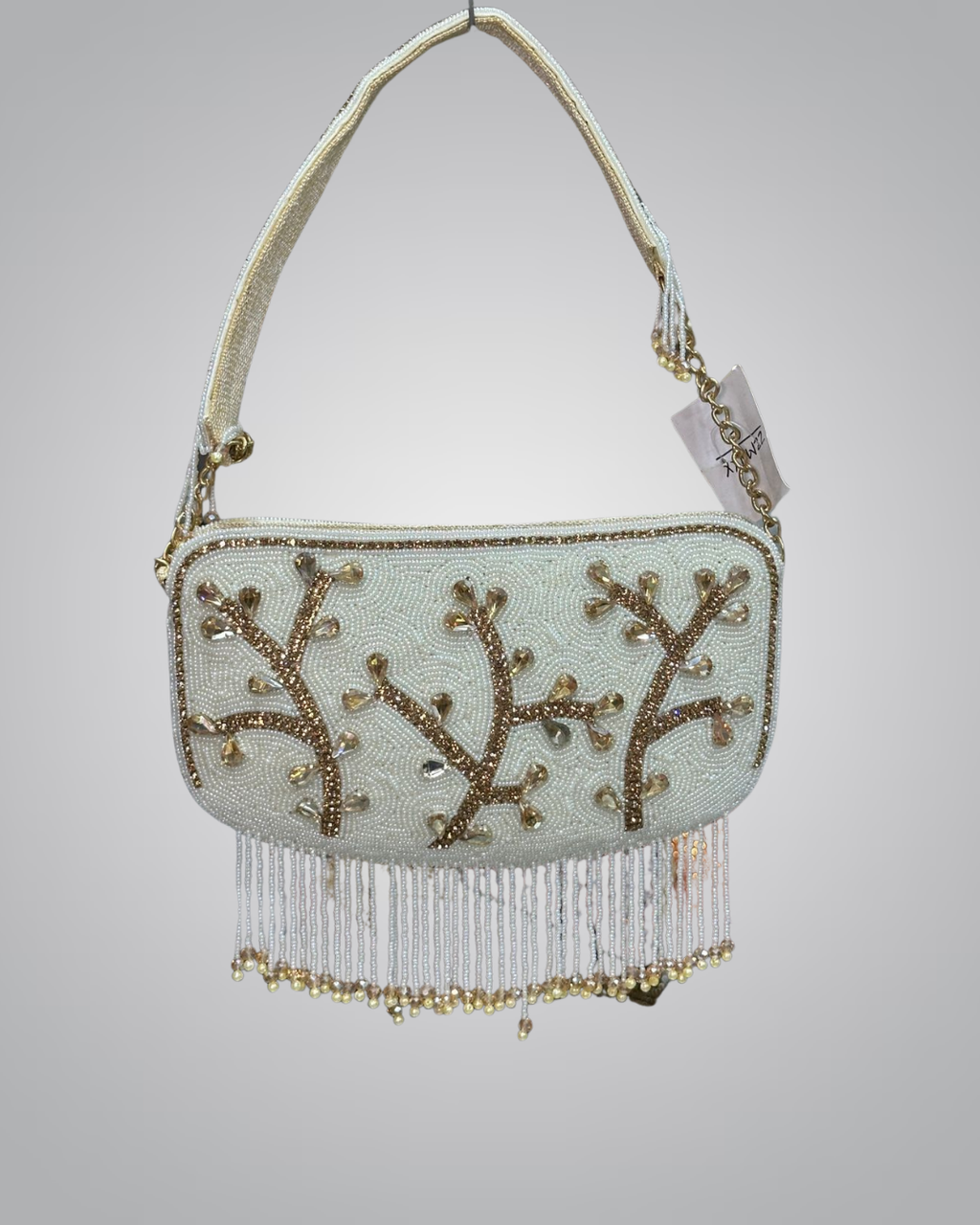 Beaded handbag with gold accents on a light gray background