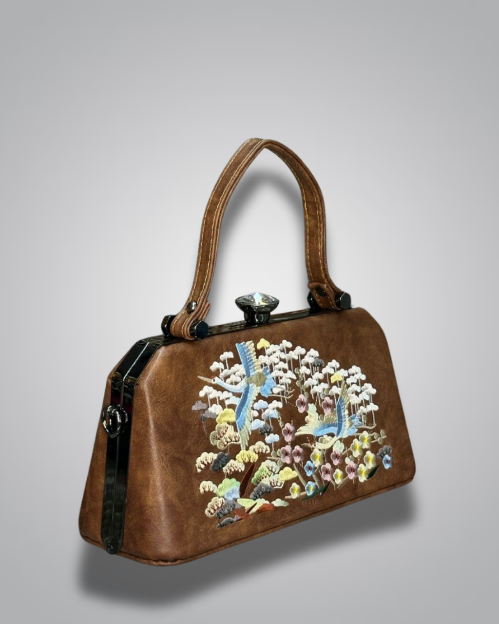 Brown handbag with floral and bird embroidery on a gray background- Valentino Impex