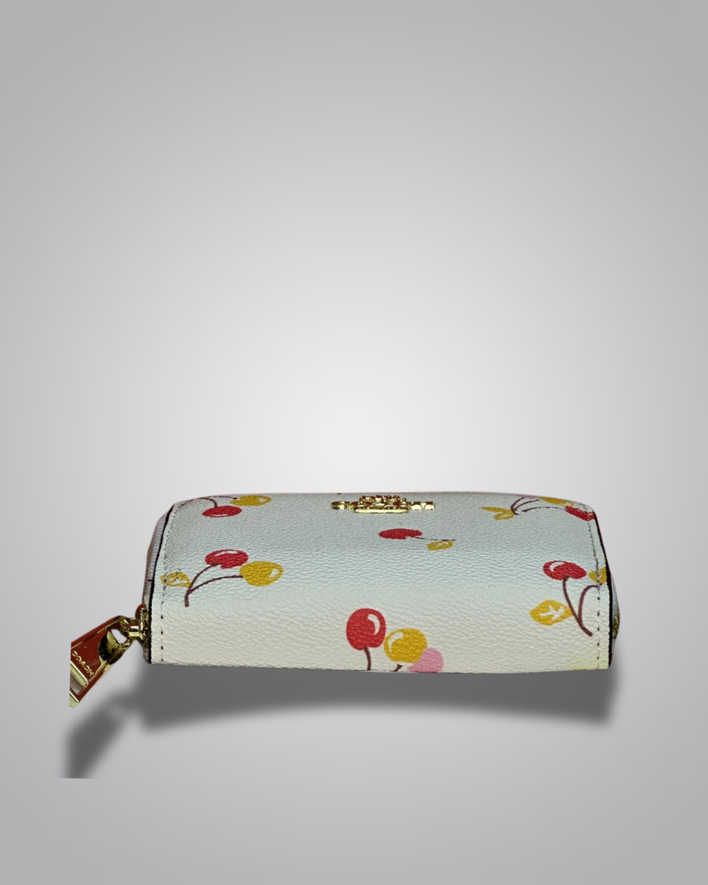 Coach cream zip wallet with red and yellow cherry print and gold Coach logo- Valentino Impex