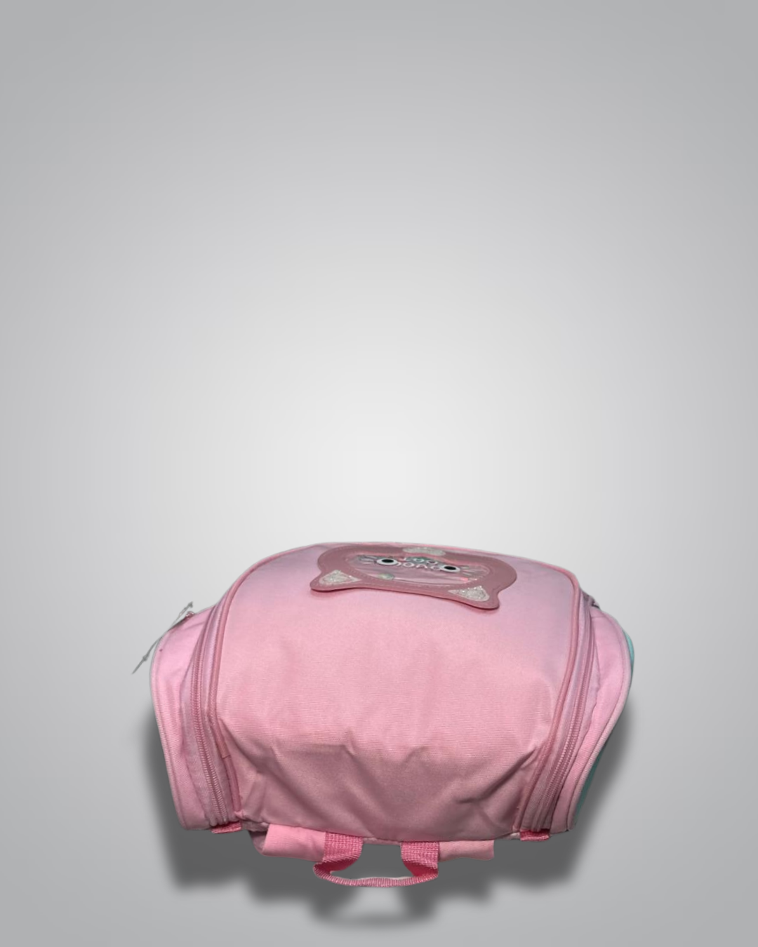 Pink helmet with a cartoon face design on a light gray background- Valentino Impex
