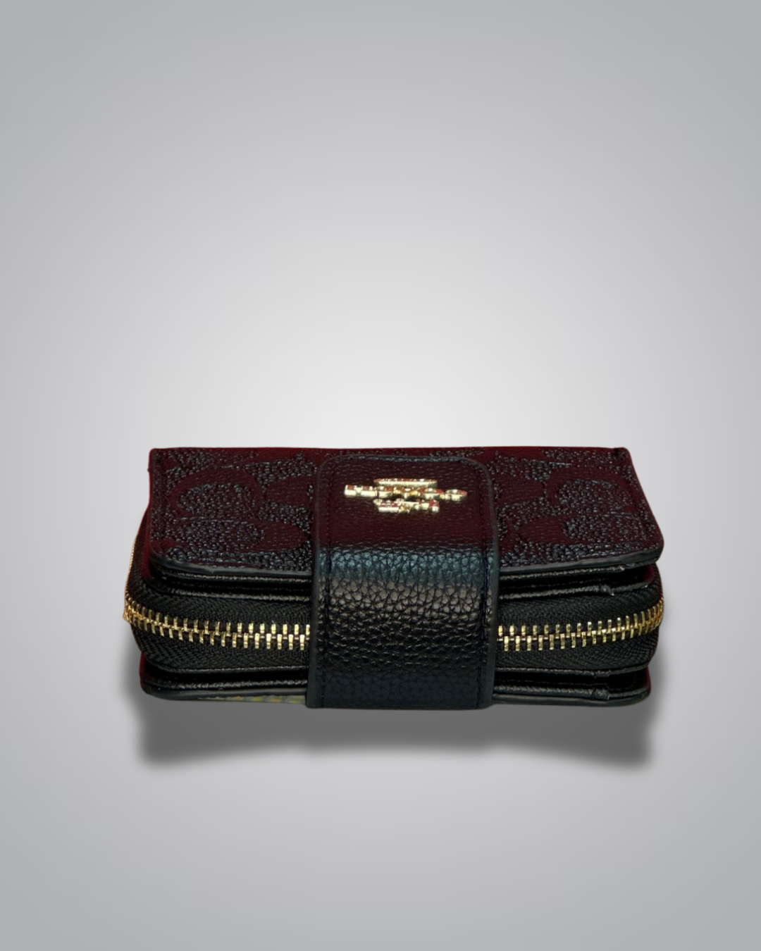 Foldable wallet with gold zipper on a gray background