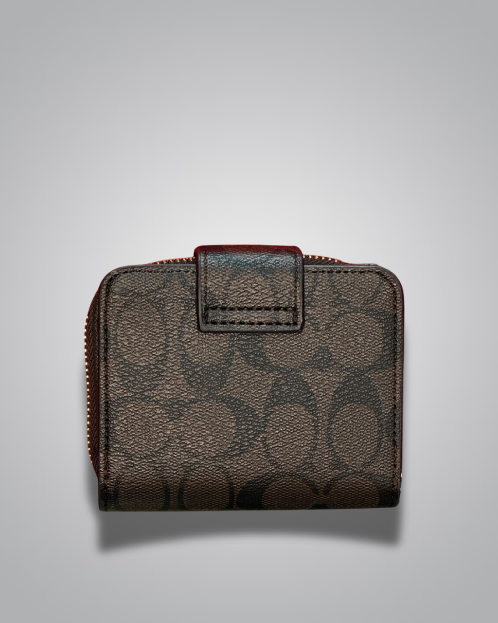 Brown leather wallet with a zipper on a light gray background