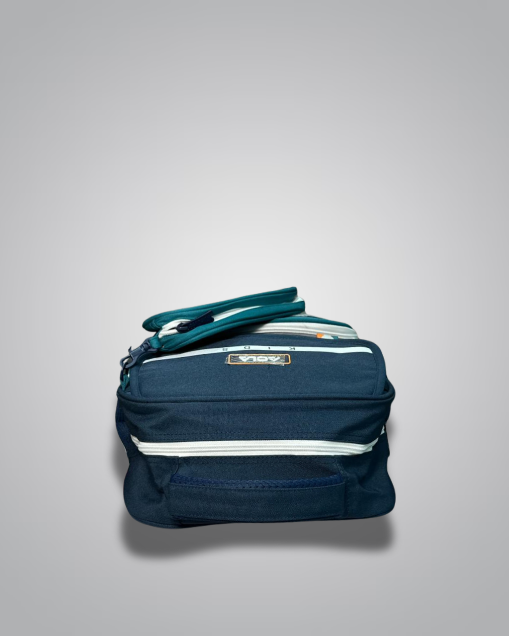 Navy blue bag with a green strap on a light gray background- Valentino Impex
