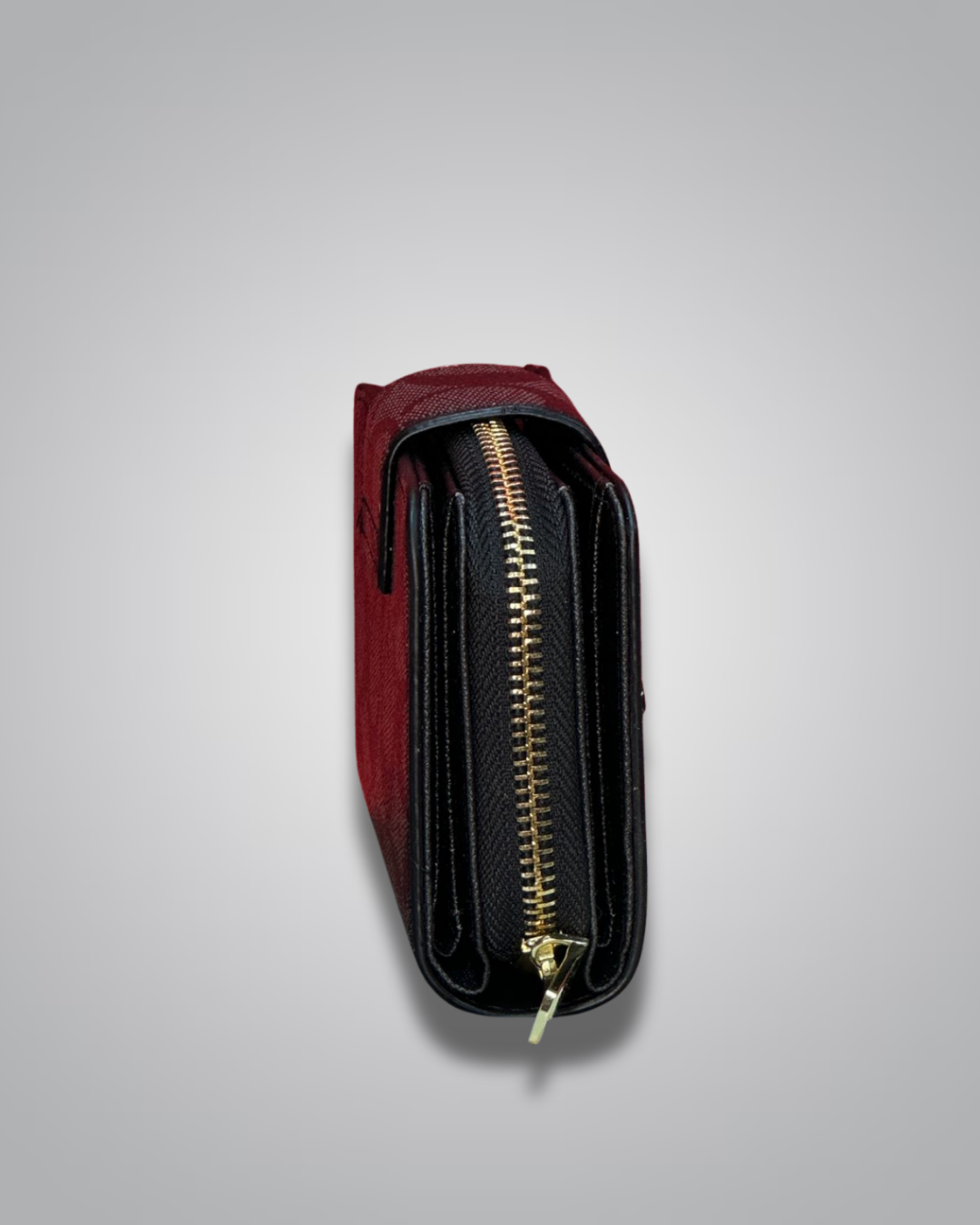 Red wallet with a gold zipper on a light gray background
