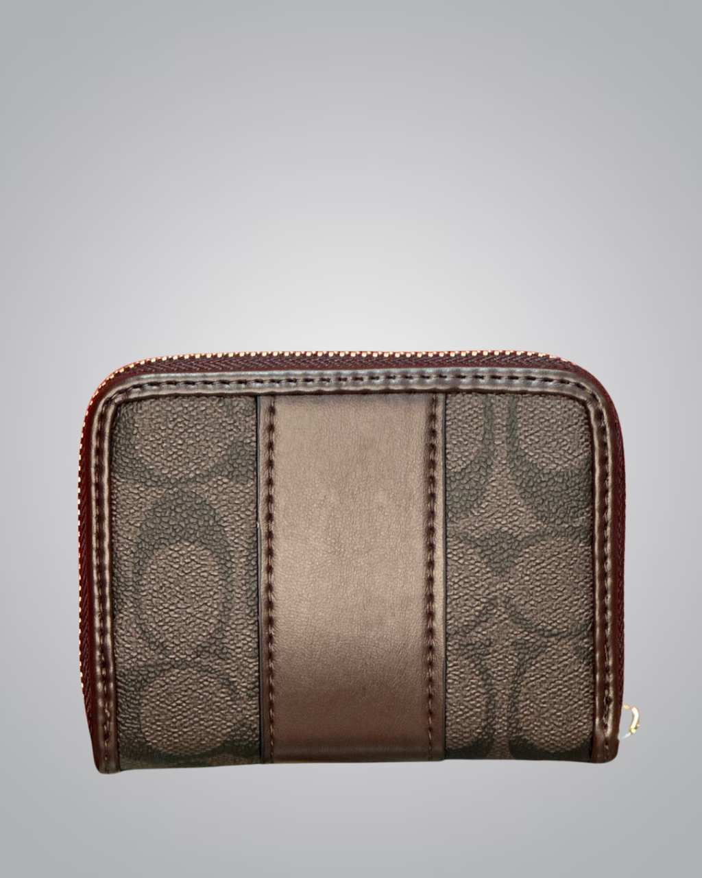 Brown wallet with patterned design on a gray background