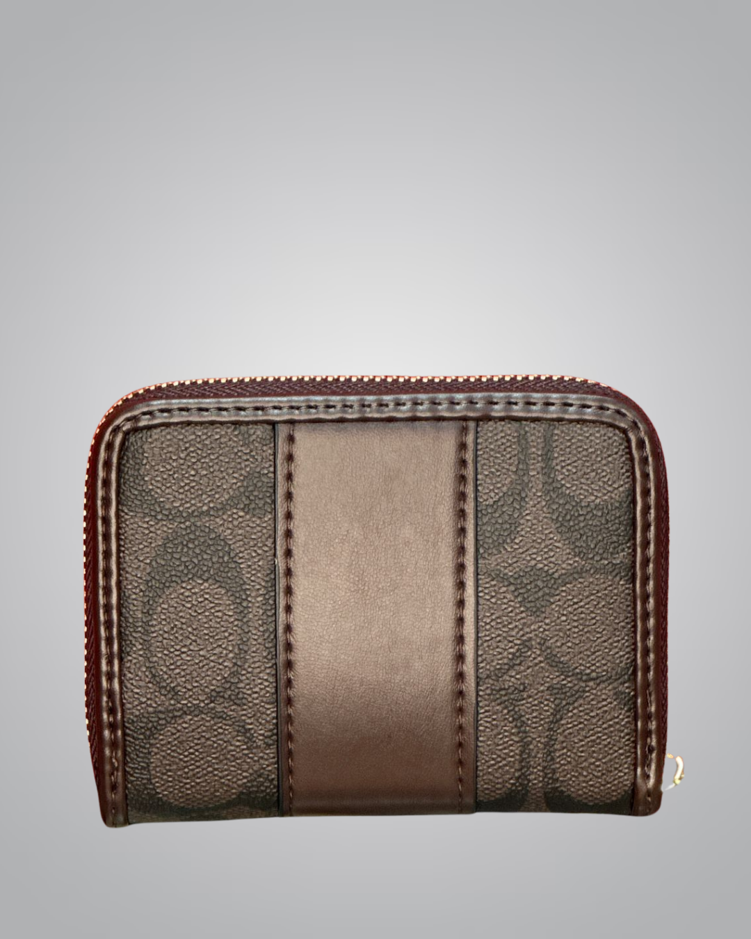 Brown wallet with patterned design on a gray background