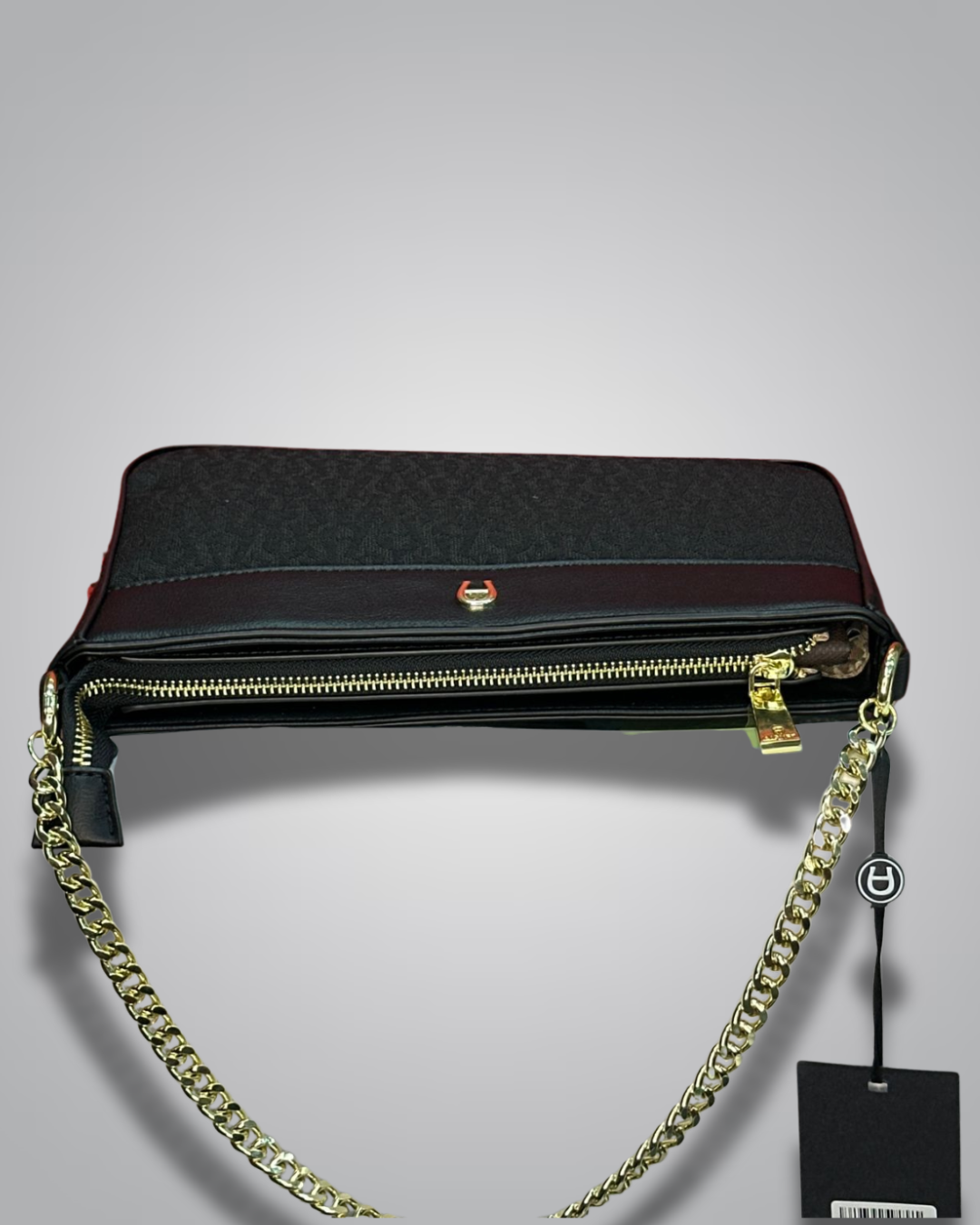 Black handbag with gold chain strap on a gray background- Valentino Impex