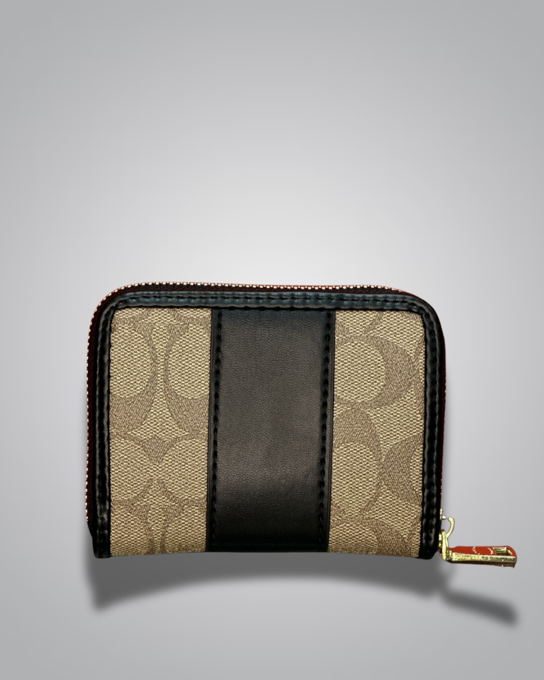 Two-tone wallet with beige and black design on a gray background