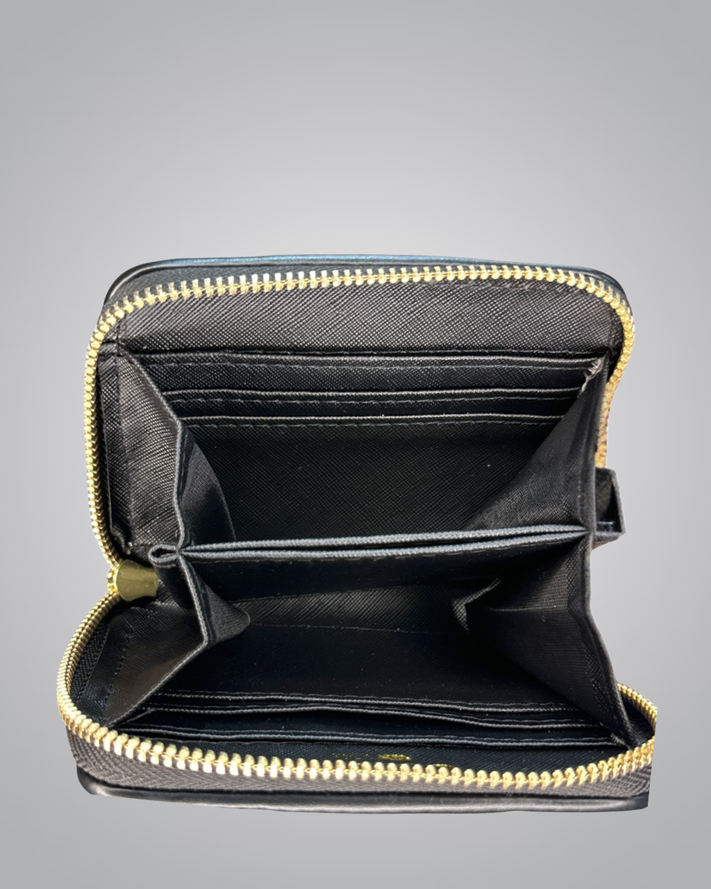 Black wallet with gold zipper on a gray background