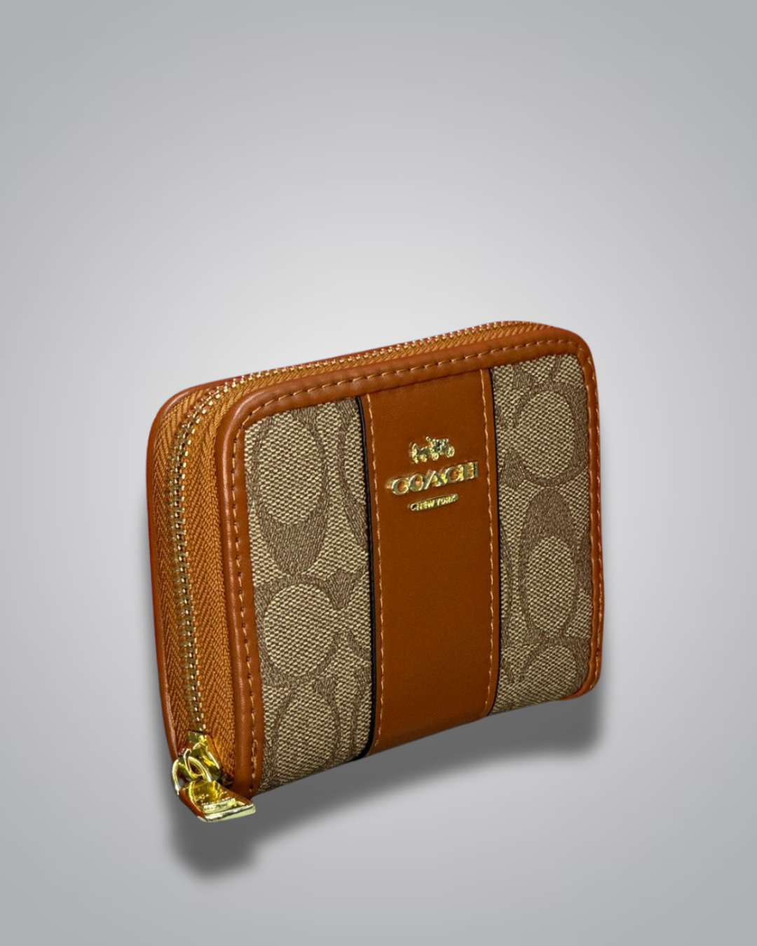 Coach wallet with brown and beige pattern on a gray background