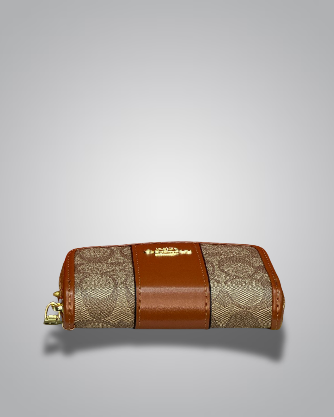 Designer wallet with gold and brown pattern on a gray background