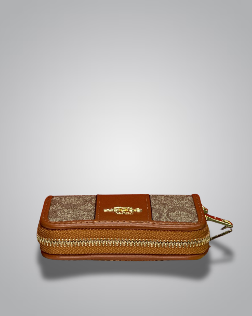 Brown and beige wallet with gold accents on a light gray background