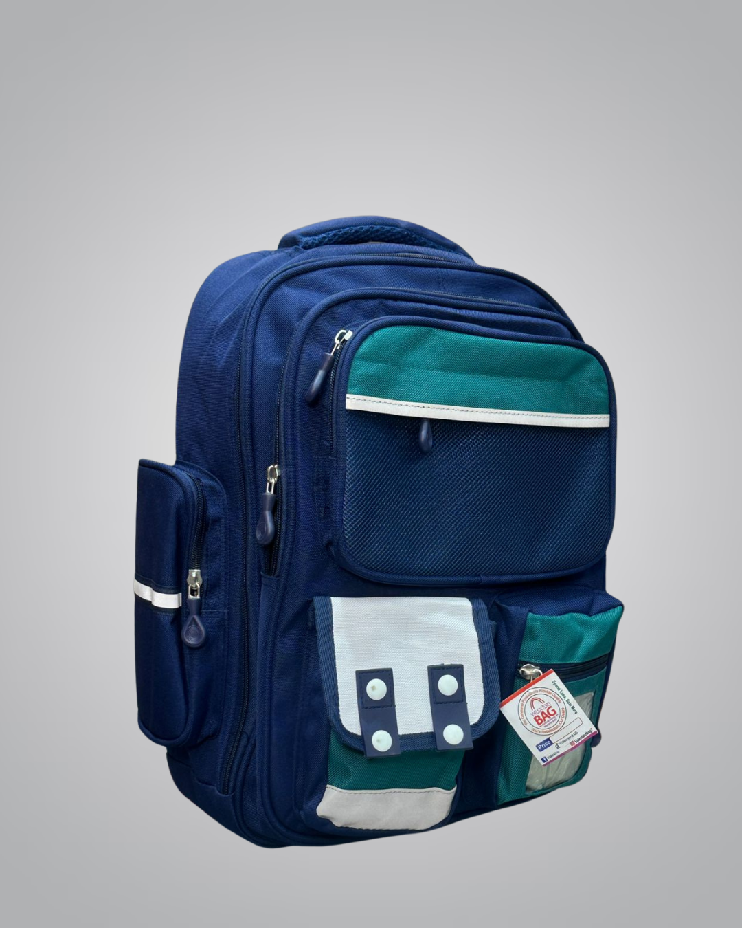 Blue and green backpack with a visible brand tag on a gray background
