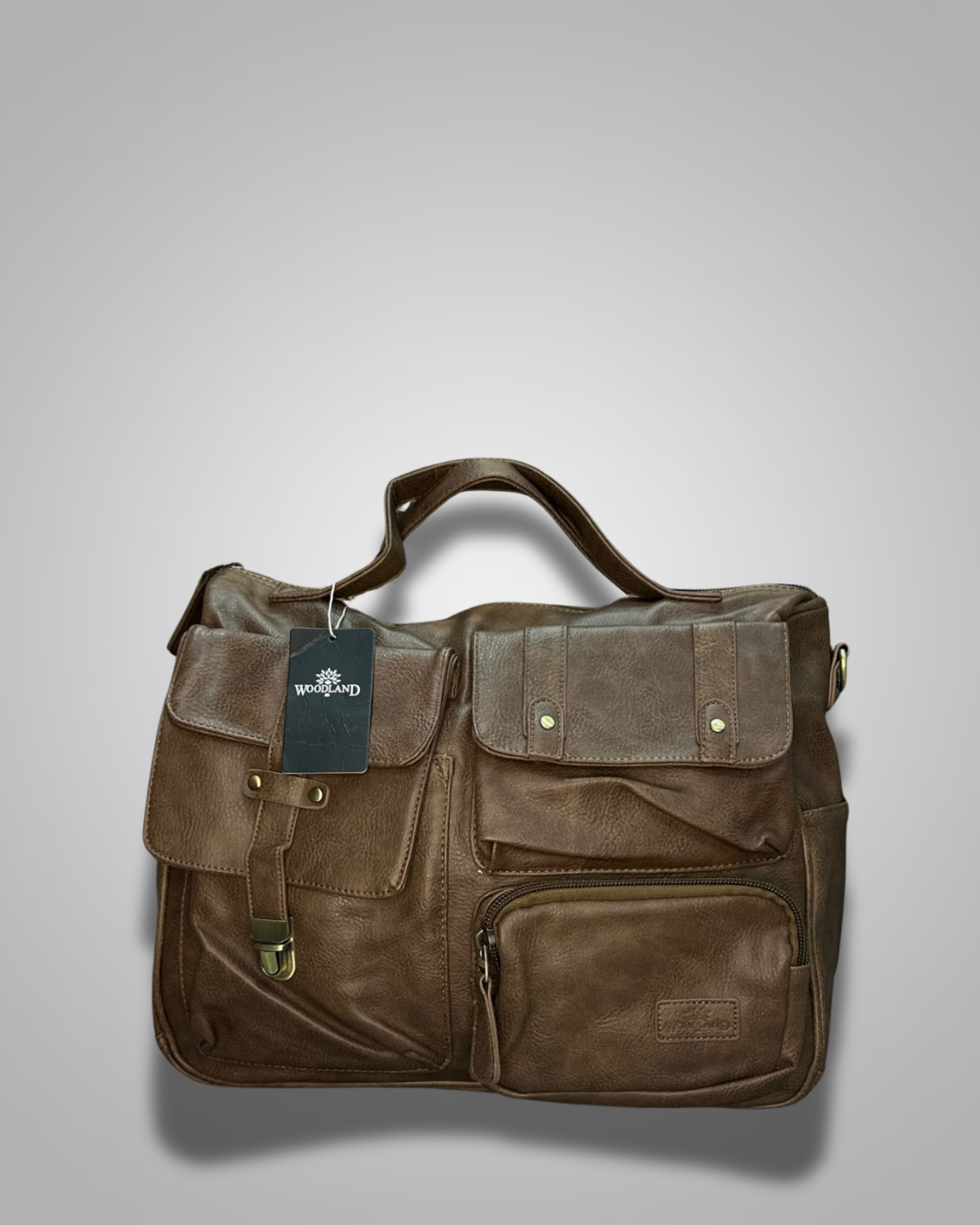 Brown leather bag with a tag on a gray background- Valentino Impex