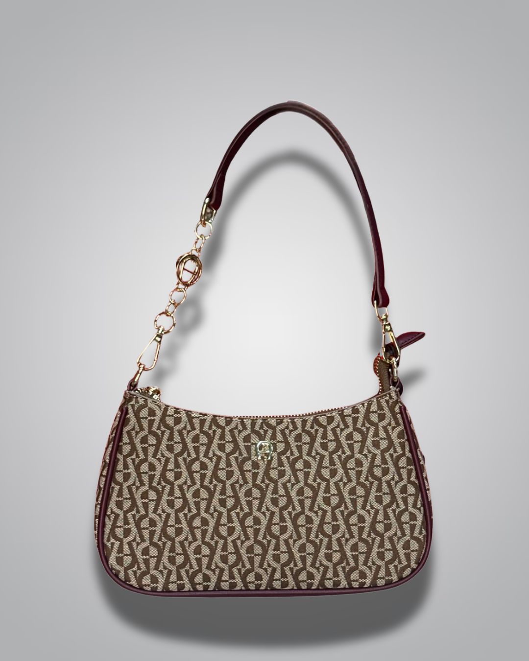 Handbag with monogram pattern on a gray background- Valentino Impex