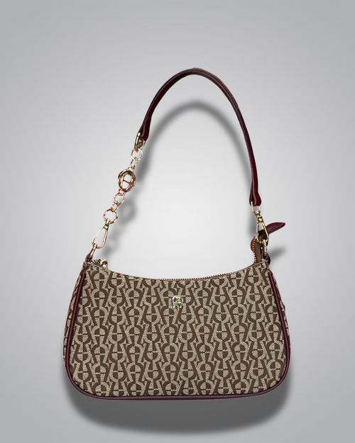 Handbag with monogram pattern on a gray background- Valentino Impex