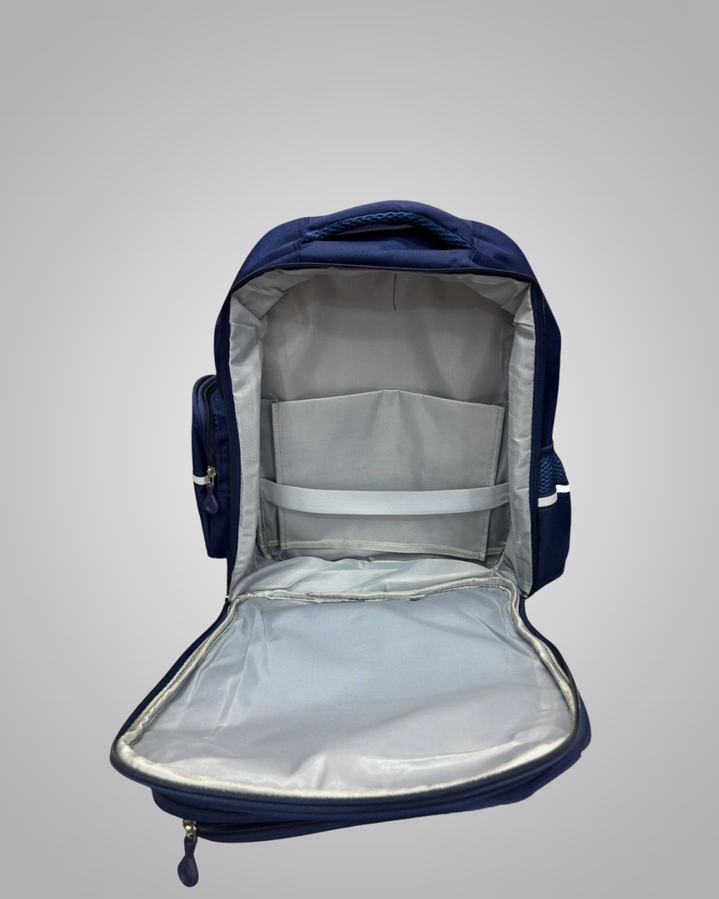 Navy blue backpack with open front compartment on a light gray background