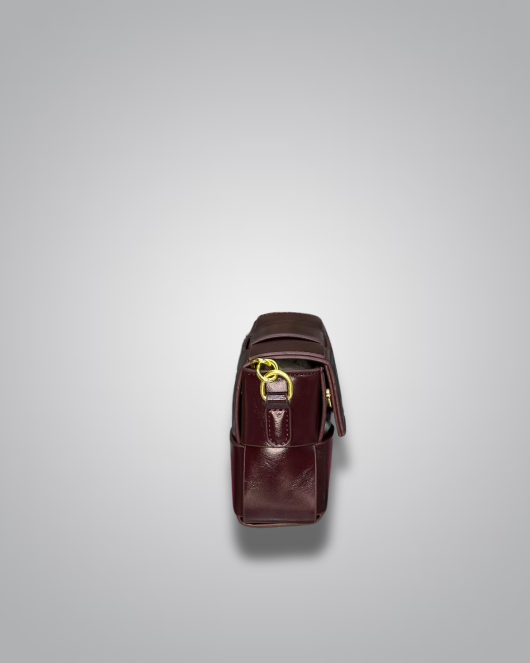 Brown leather bag with gold zipper on a light gray background- Valentino Impex