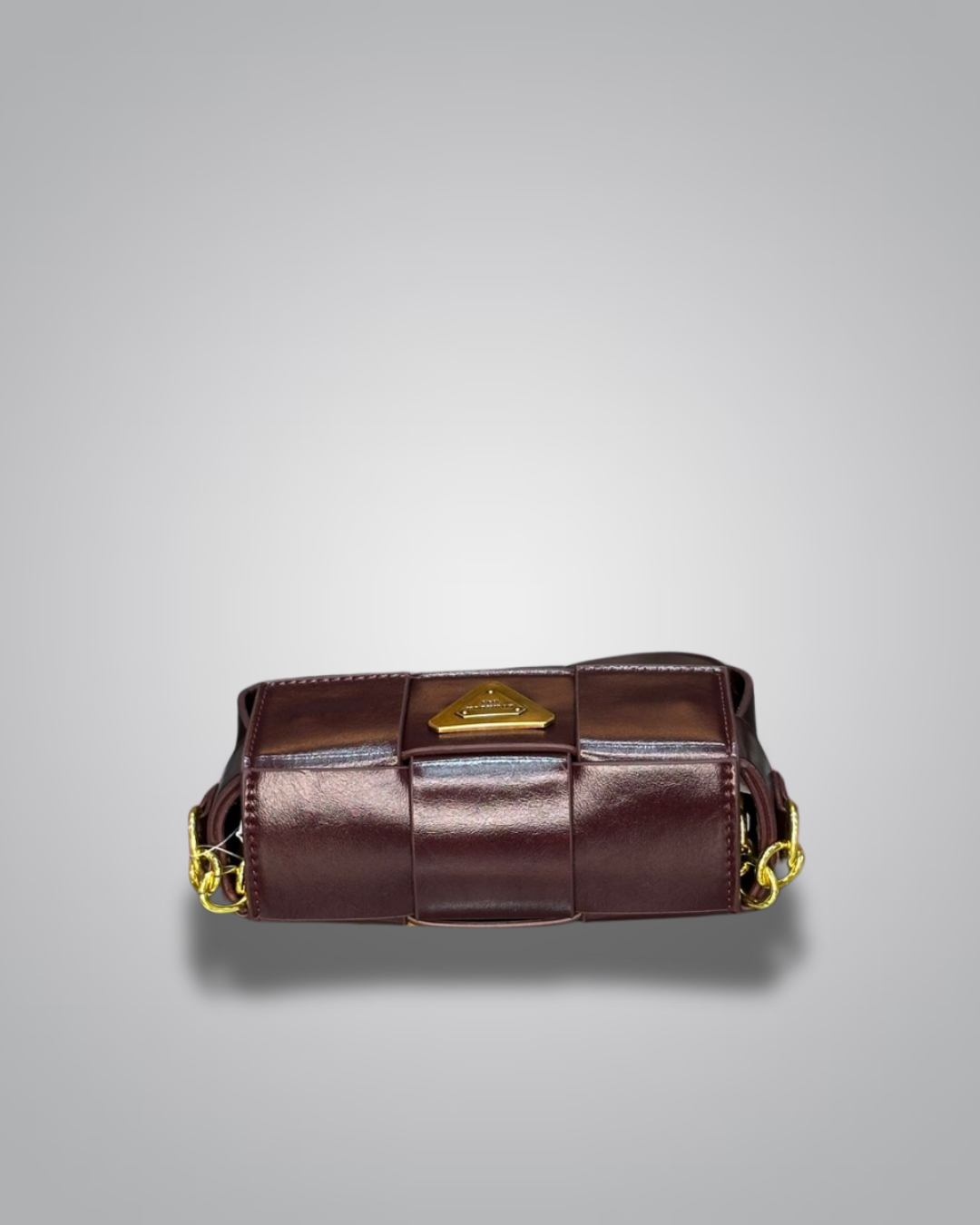 Brown leather bag with gold accents on a gray background- Valentino Impex