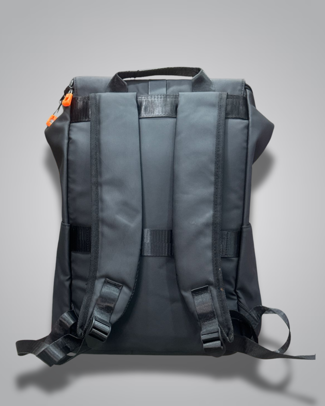 Black backpack with a visible brand label on a gray background- Valentino Impex