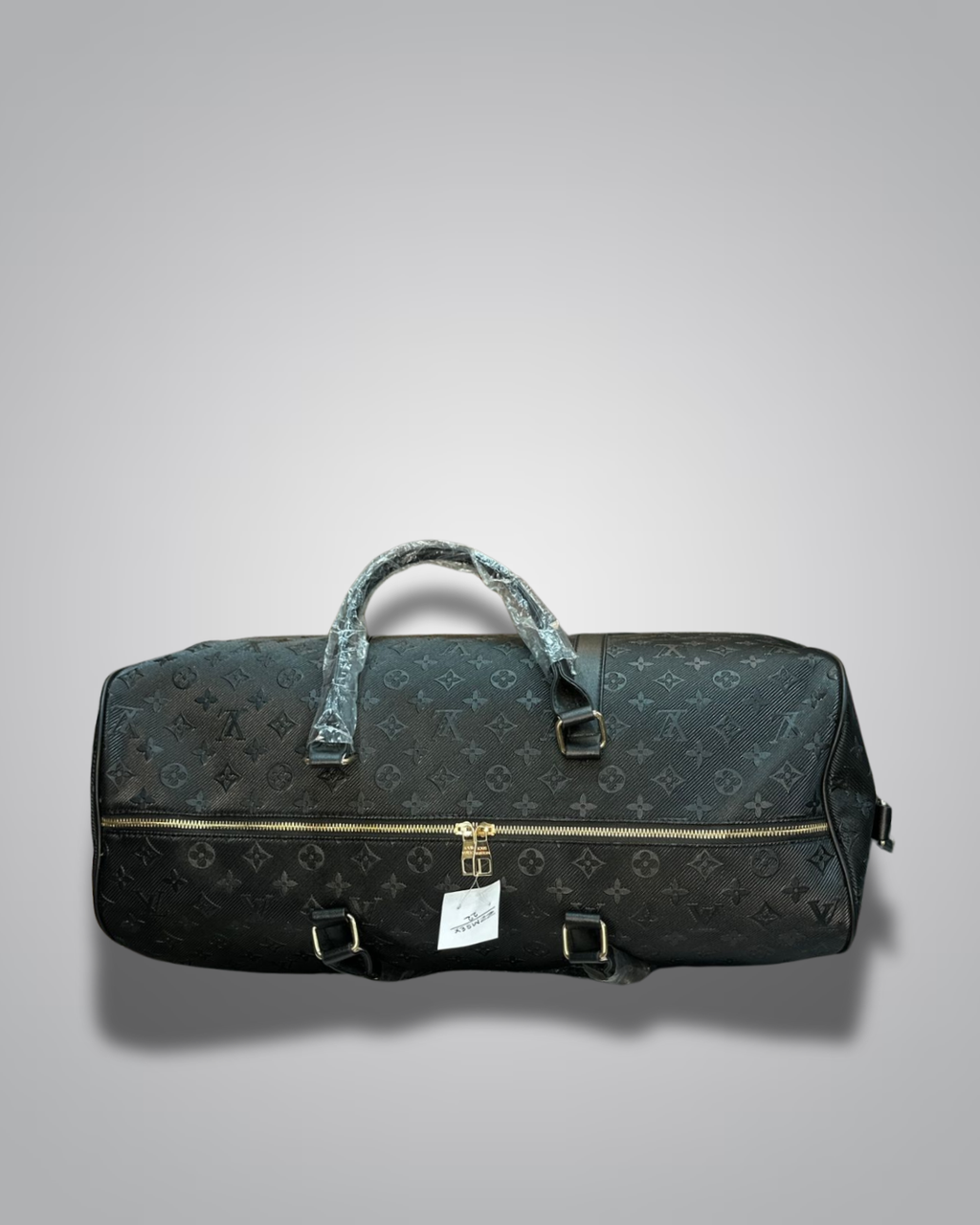 Black duffel bag with monogram pattern on a gray background
