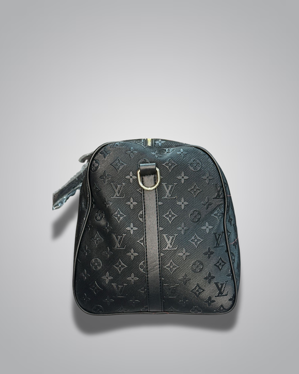 Black monogram patterned bag on a light gray background