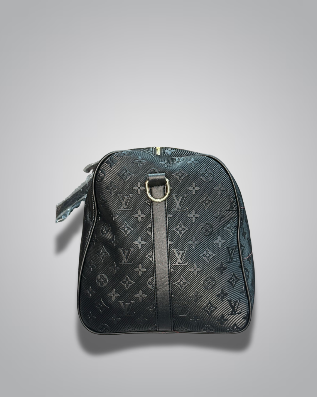 Black monogram patterned bag on a light gray background
