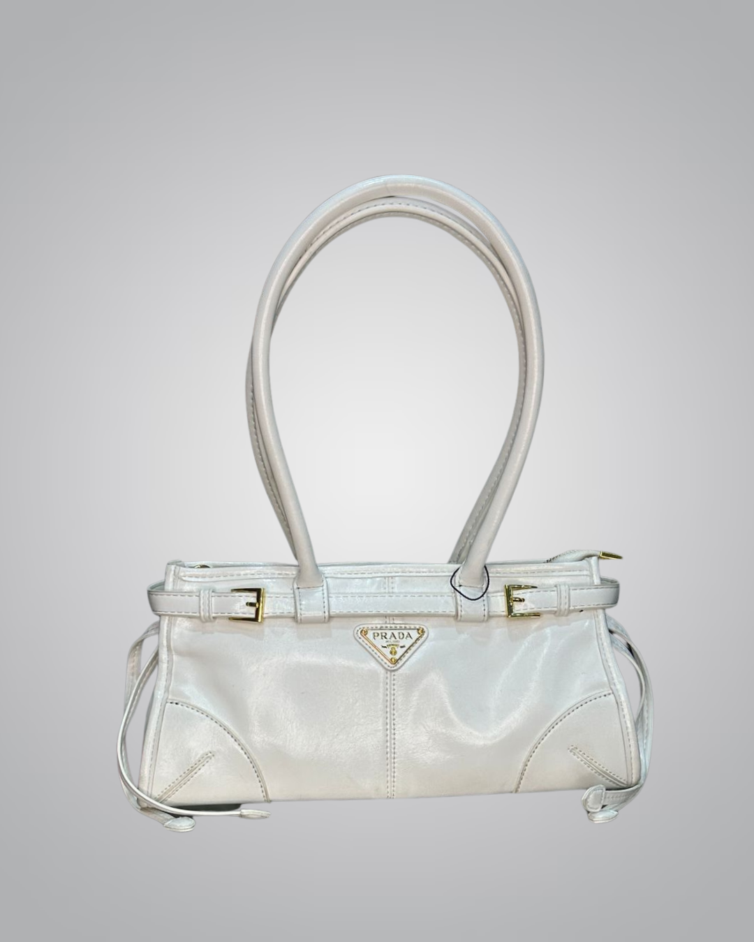 White handbag with a Prada logo on a light gray background