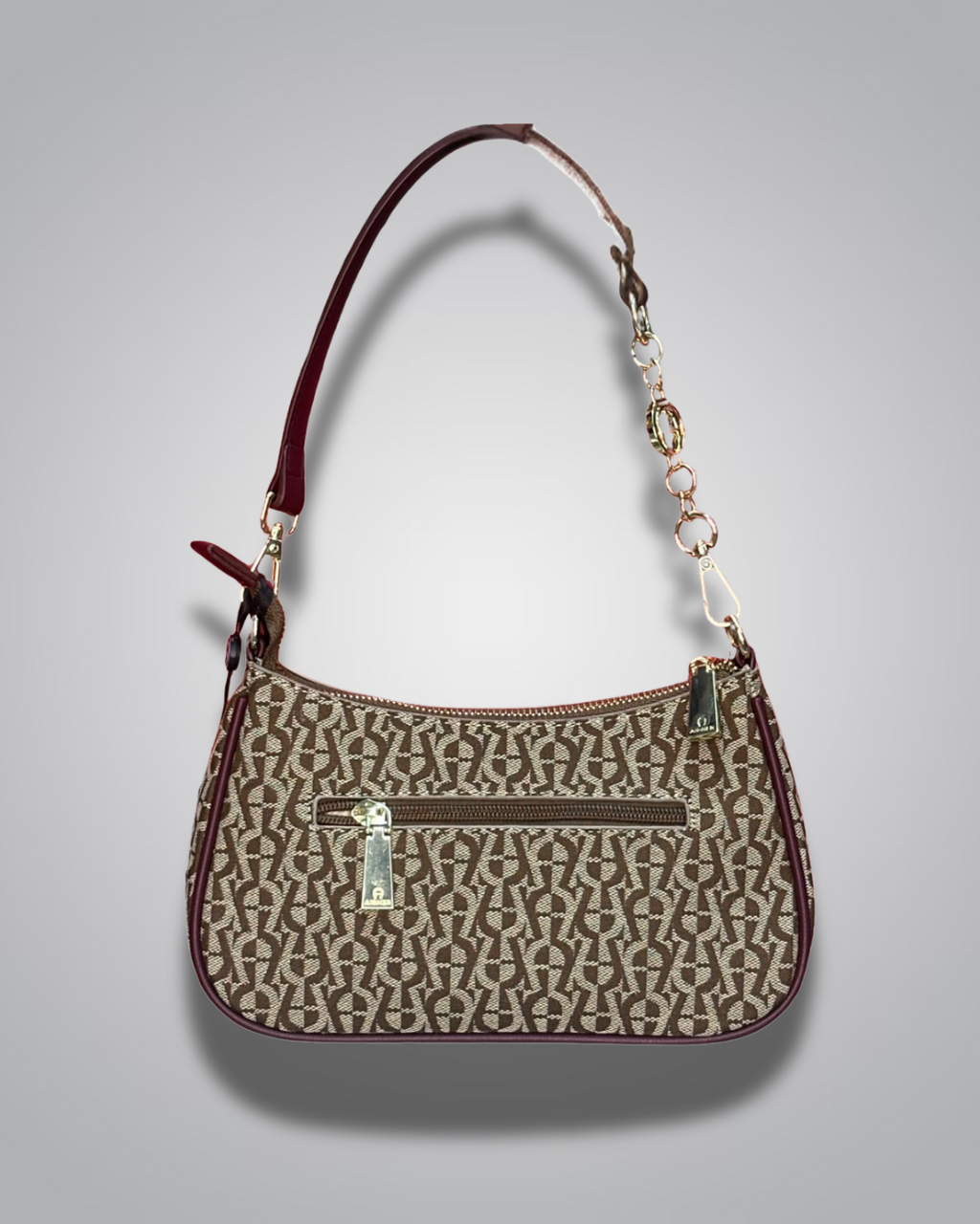 Handbag with monogram pattern on a gray background- Valentino Impex