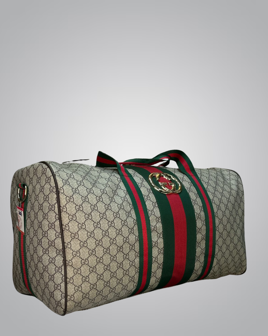 Gucci duffel bag with monogram pattern and green and red stripe on a gray background- Valentino impex
