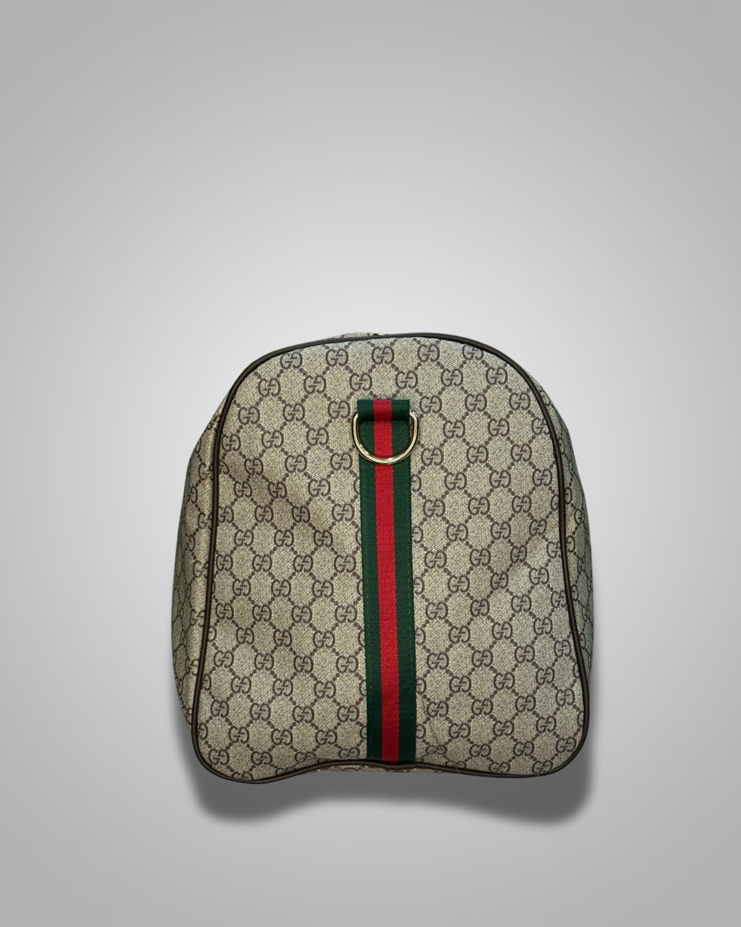 Gucci backpack with monogram pattern and green and red stripe on a light gray background