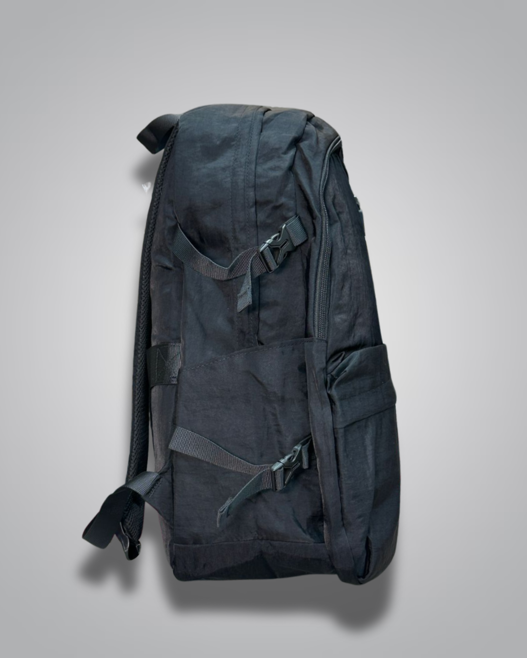 Black backpack with a visible brand label on a gray background- Valentino Impex