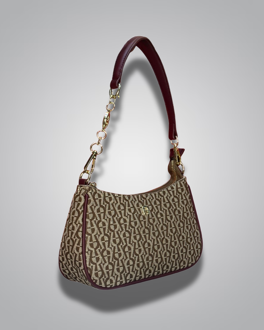 Handbag with monogram pattern on a gray background- Valentino Impex