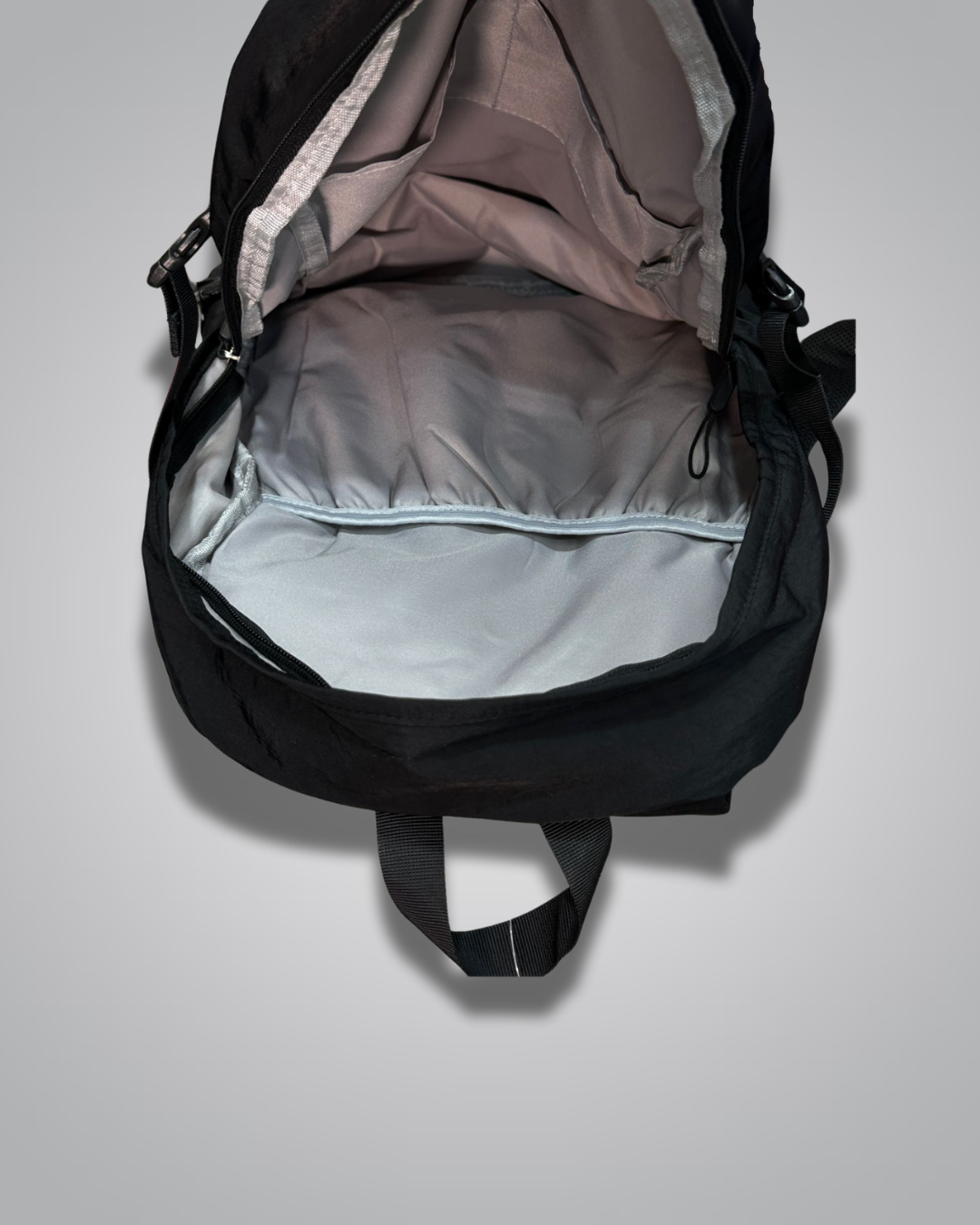 Black backpack with a visible brand label on a gray background- Valentino Impex