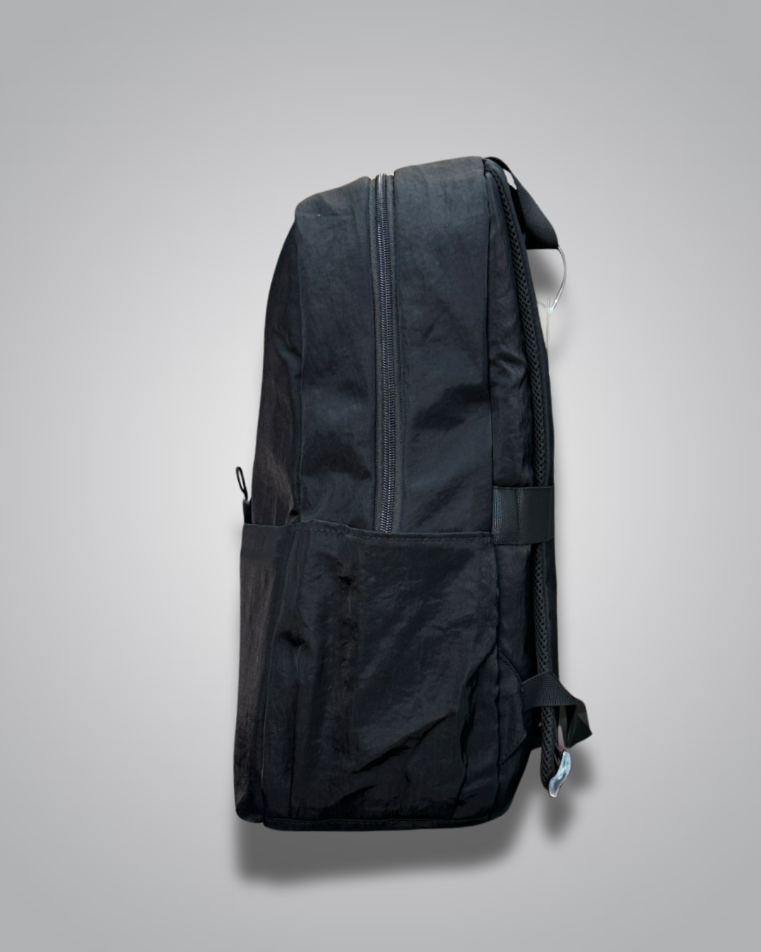 Black backpack on a light gray background- valentini impex