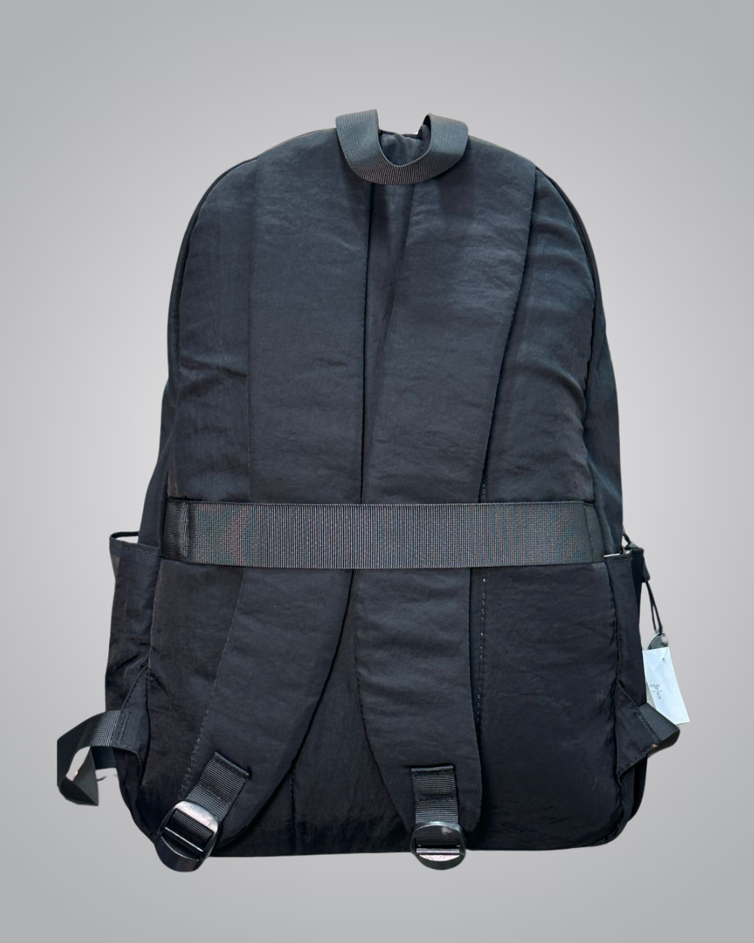 Black backpack on a gray background- valentini impex