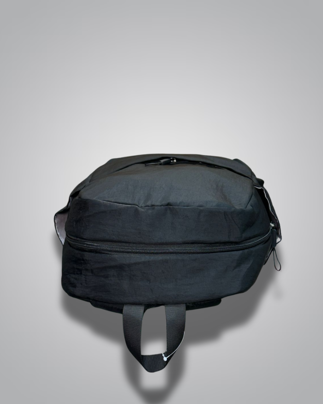 Black backpack on a light gray background- valentini impex