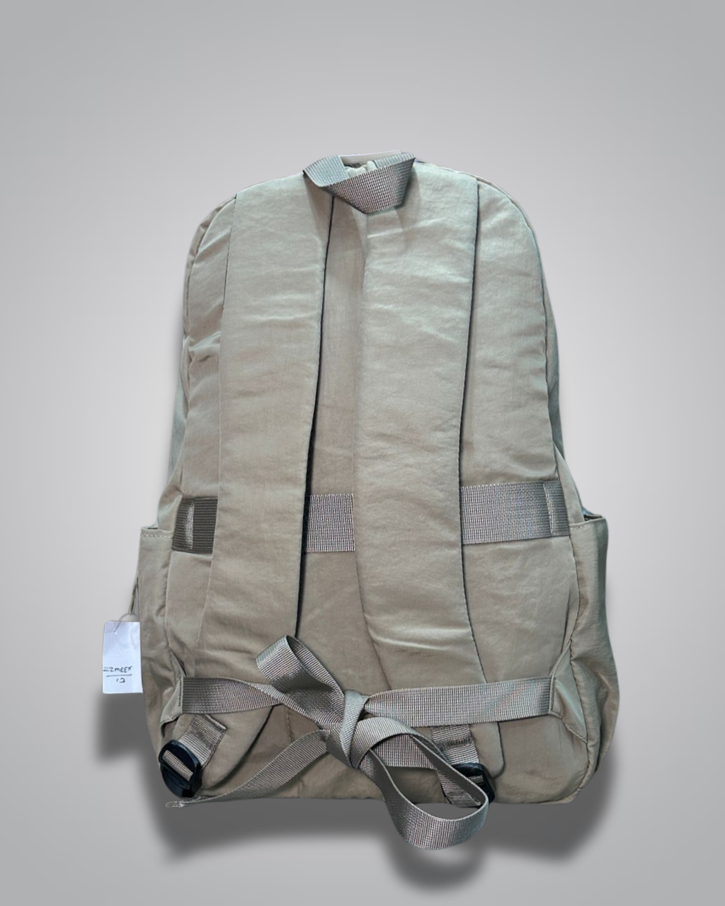 Beige backpack on a light gray background- valentini impex