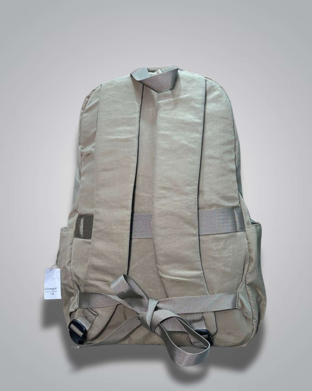 Beige backpack on a light gray background- valentini impex