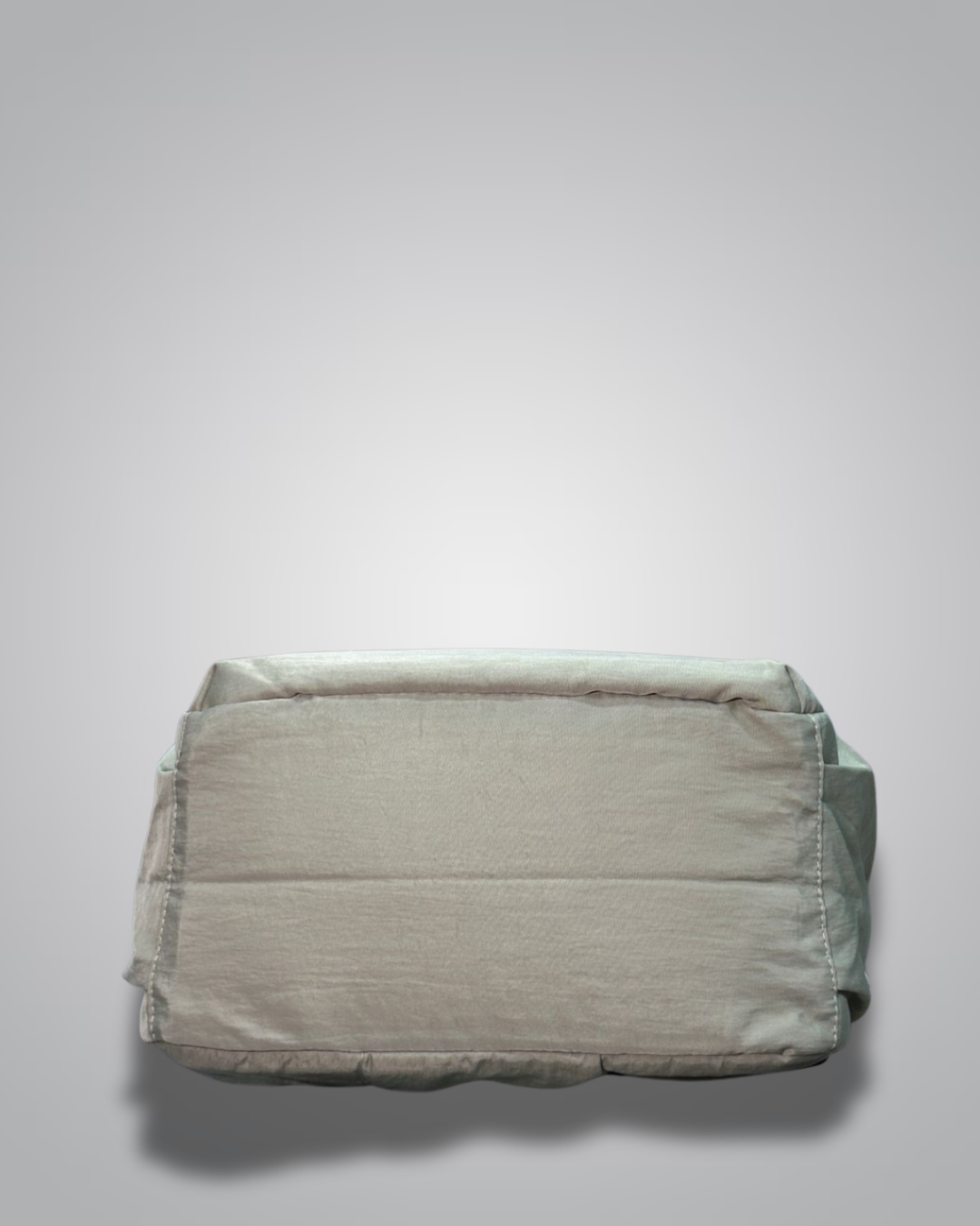 Folded light gray diaper on a white background- valentini impex