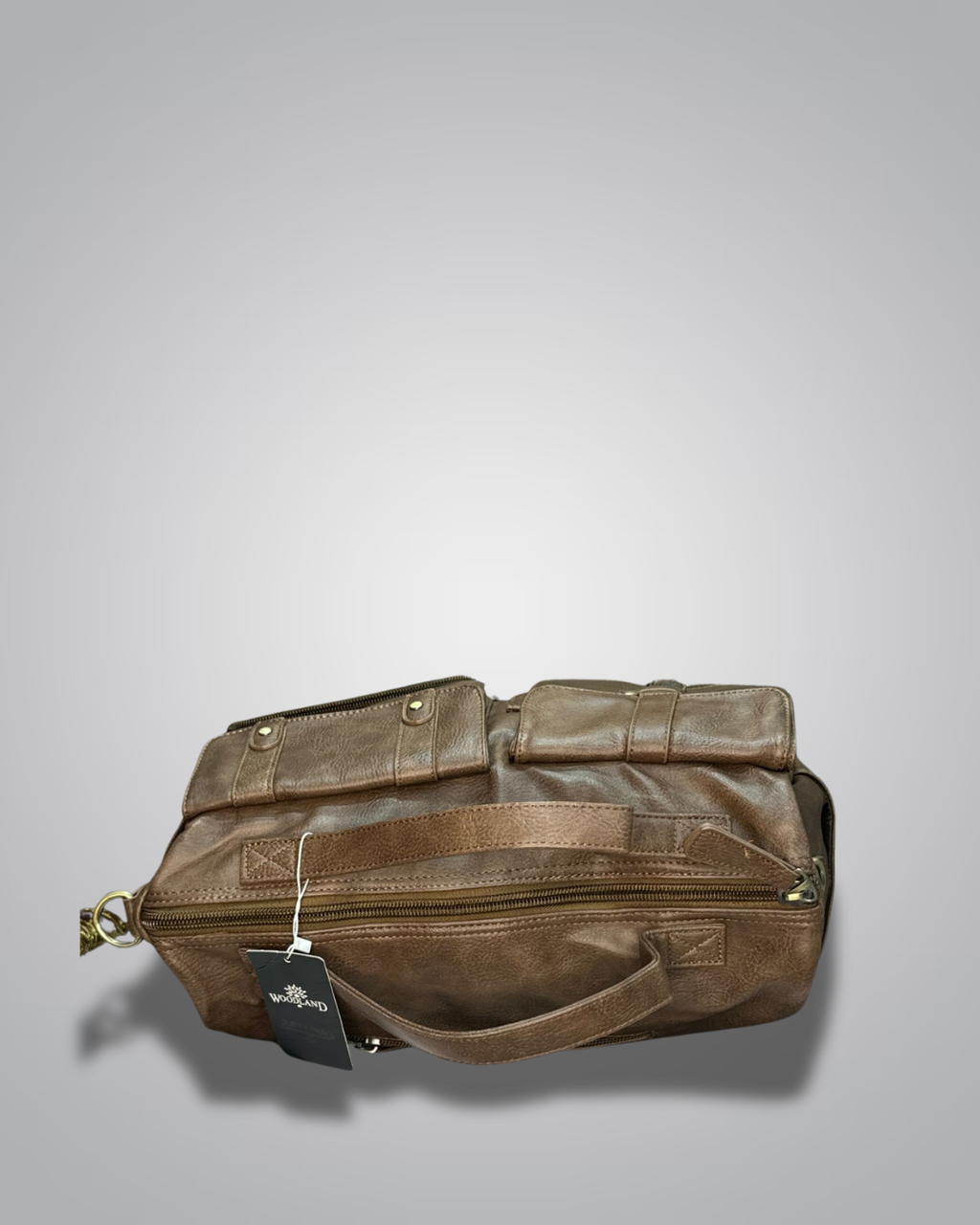 Brown leather bag with a tag on a gray background- Valentino Impex