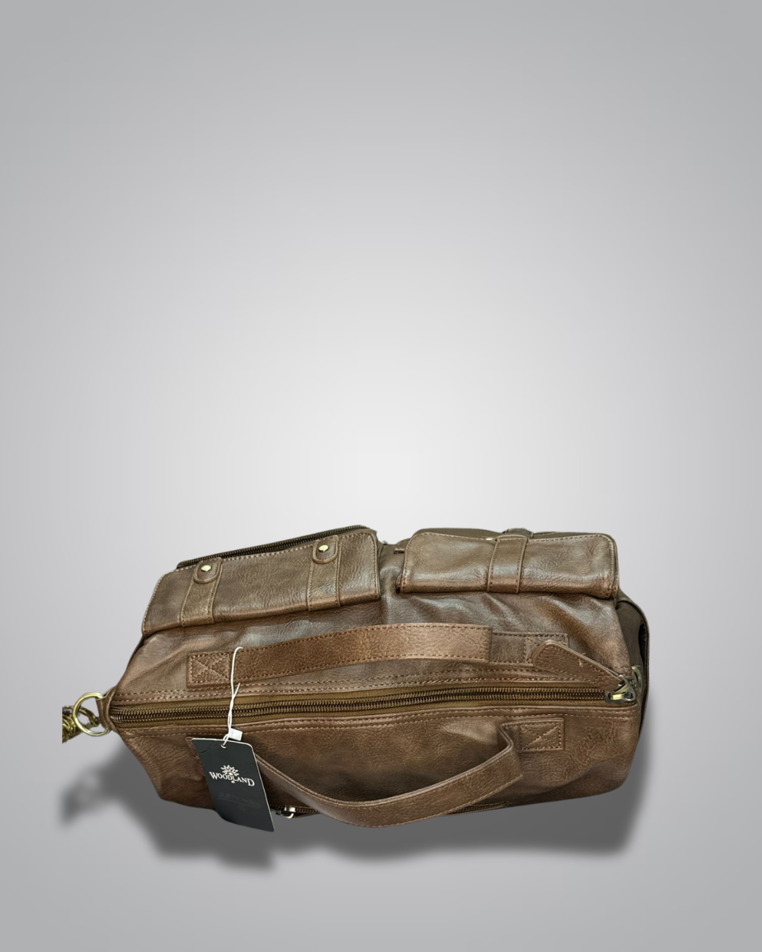 Brown leather bag with a tag on a gray background- Valentino Impex
