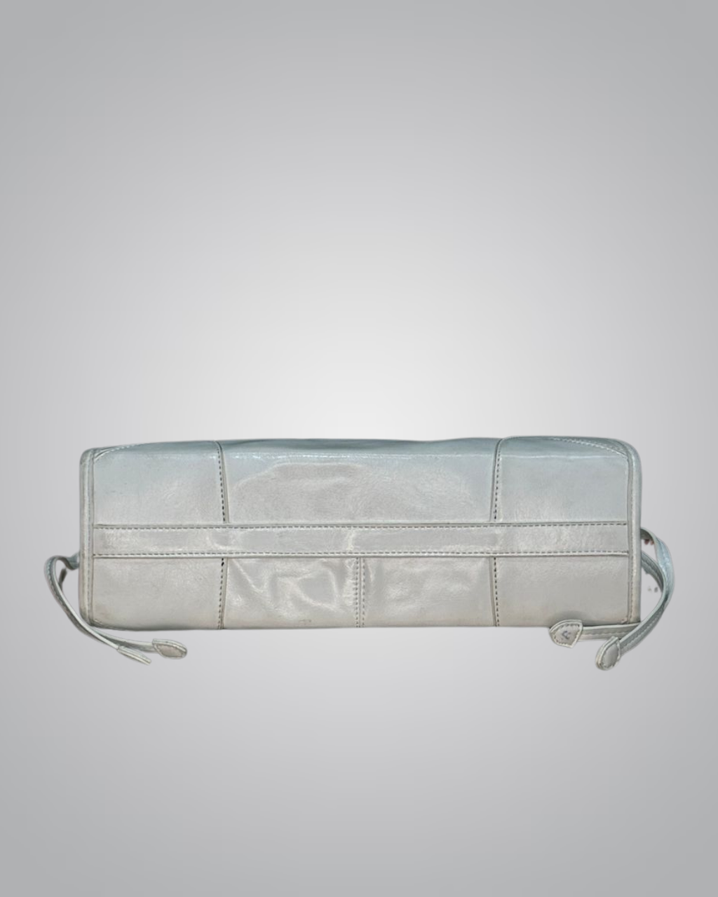 Light blue quilted handbag on a light gray background